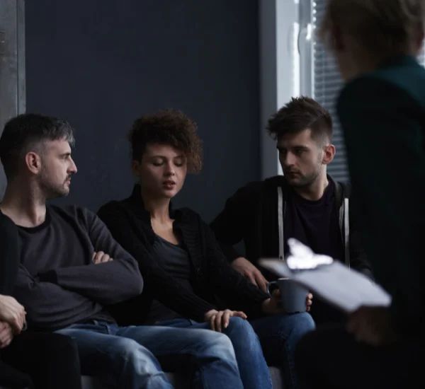 A group of people taking in a Drug Detox support group