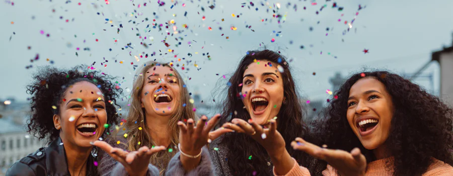 friends throwing confetti - celebrating relapse addiction prevention friends throwing confetti - celebrating stay off drugs after rehab