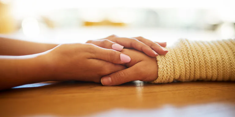 holding hands - support a friend through drug use