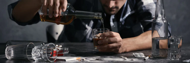 drug and alcohol addiction - bottles and pills