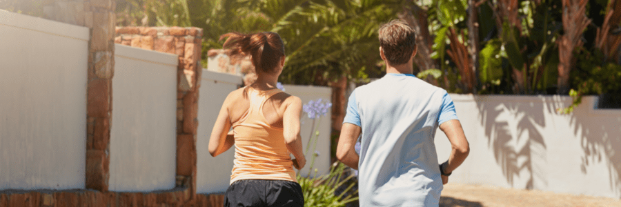 man and woman running - healthy living is critical to the rehab process