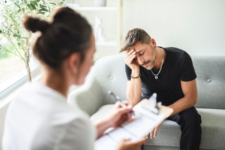 Man with addiction being diagnosed with addiction