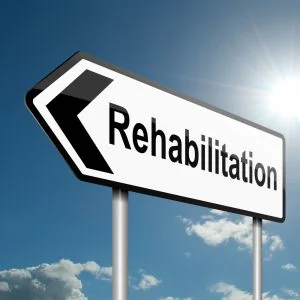 A road sign with rehabilitation on it