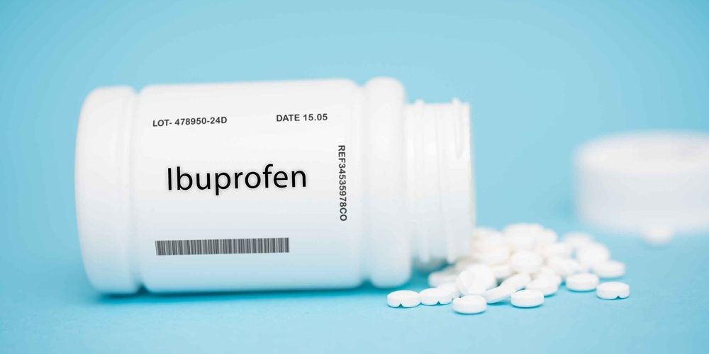 Ibuprofen,Nonsteroidal,Anti-inflammatory,Drug,(nsaid),Pain,Relief,Inflammation,Nsaid,Tablet Ibuprofen bottle with tablets on the ground