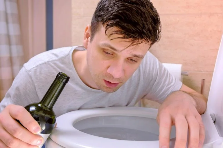 Man over a toilet due to alcohol