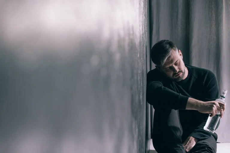 A man drinking too much