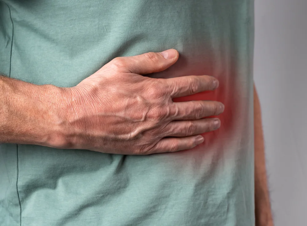 Liver,Pain.,Man,Hand,Holding,Abdomen,Right,Side,With,Red Cystitis and alcohol