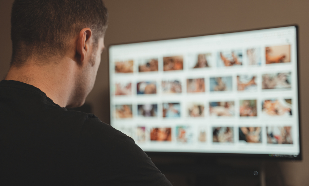 Man views porn late at night porn is blurred