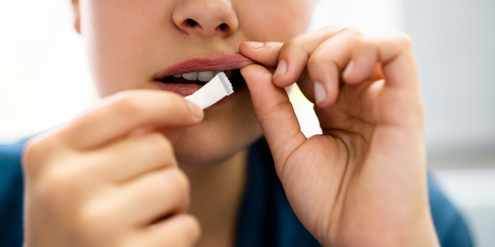 Woman using Snus
