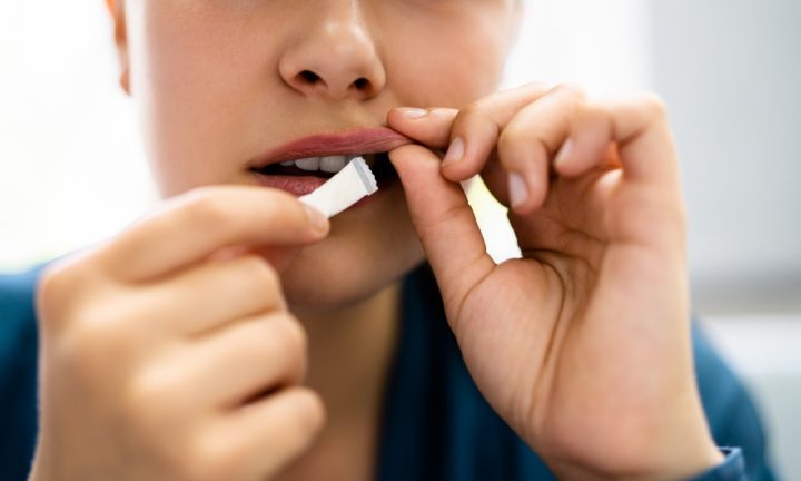 Woman,Chewing,Wet,Moist,Nicotine,Tobacco,Snus,Product Woman using Snus