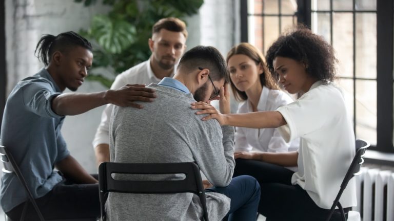 Circle of people having an intervention