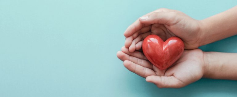 Hands holding a heart to show support at PCP