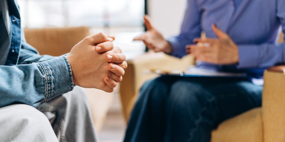 Closeup,Portrait,Of,Female,Psychologist,Discussing,Problem,With,Teenage,Boy Cannabis Addiction Therapy
