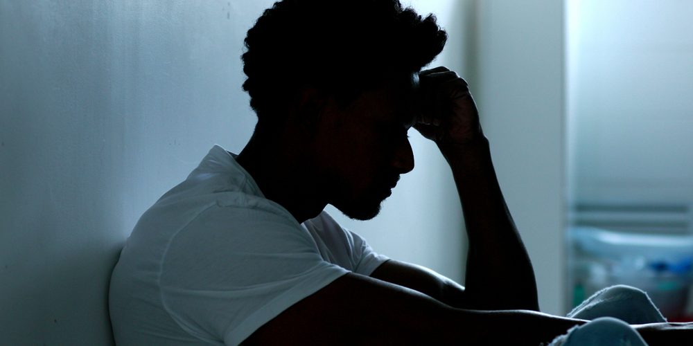 Person,Sitting,On,Floor,With,Mental,Illness Person suffering from cannabis withdrawal