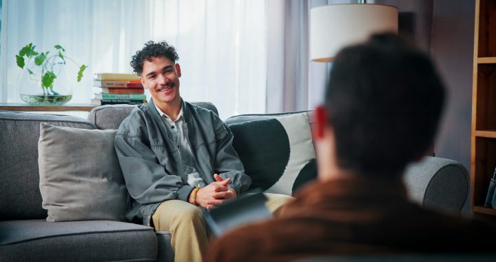 Happy,Man,,Therapy,And,Listen,To,Psychologist,For,Help,,Support Individual discussing cross addiction