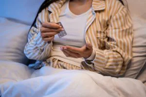 Woman taking sleep medication